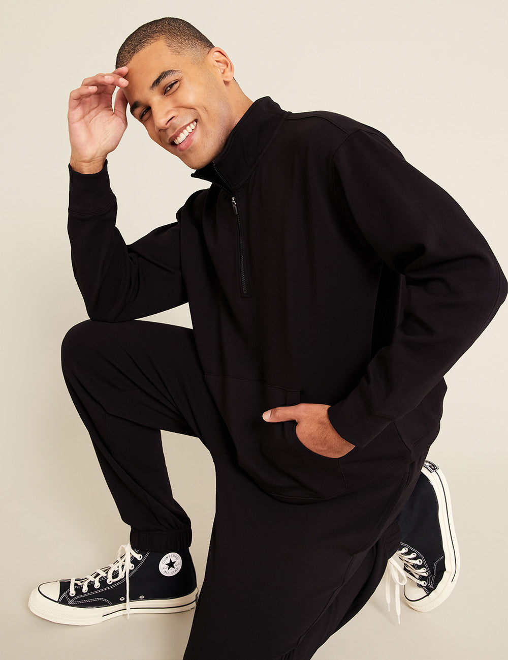 Gender-Neutral-Quarter-Zip-Sweater-Black-Male-Side-2.jpg